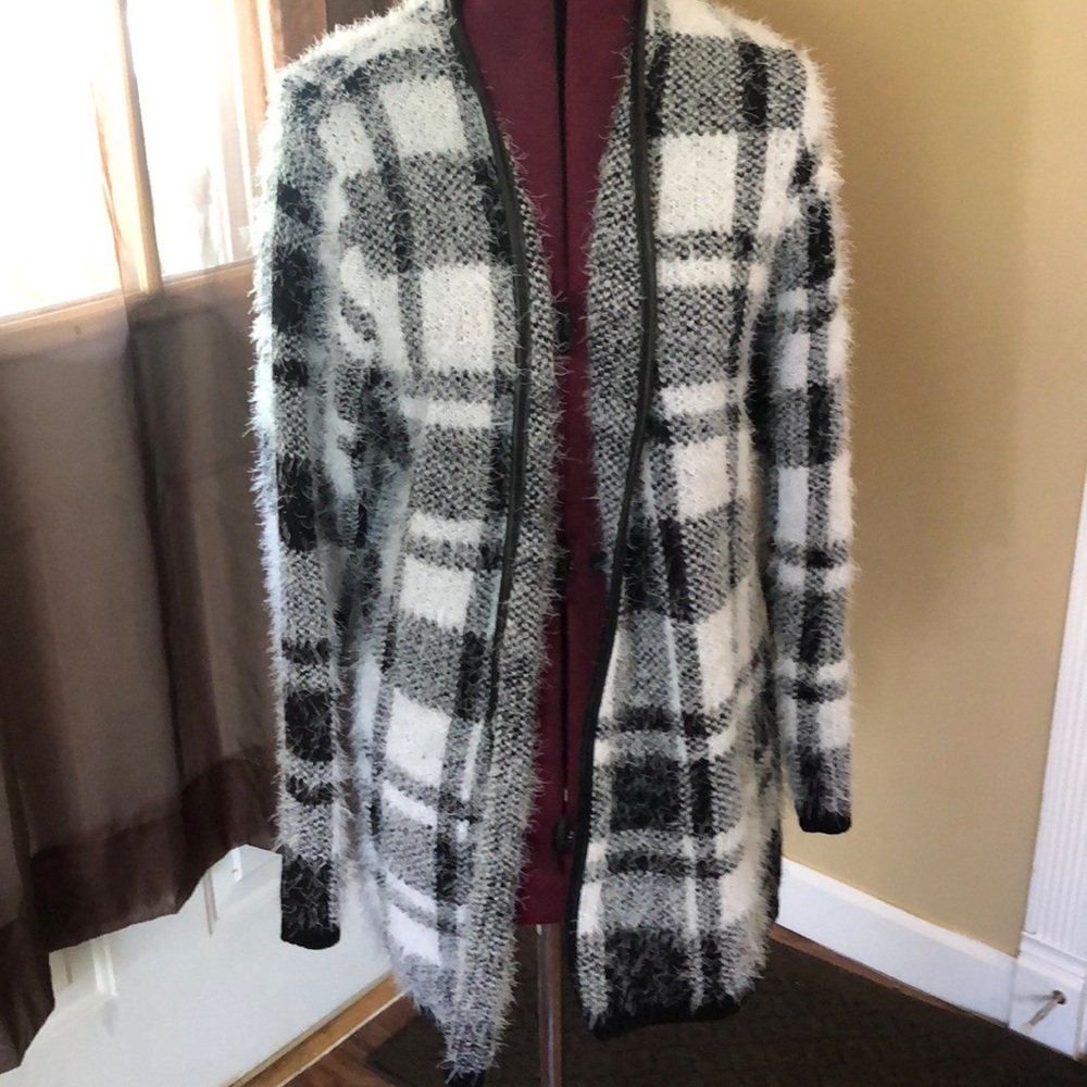 Leather trimmed black and white sweater